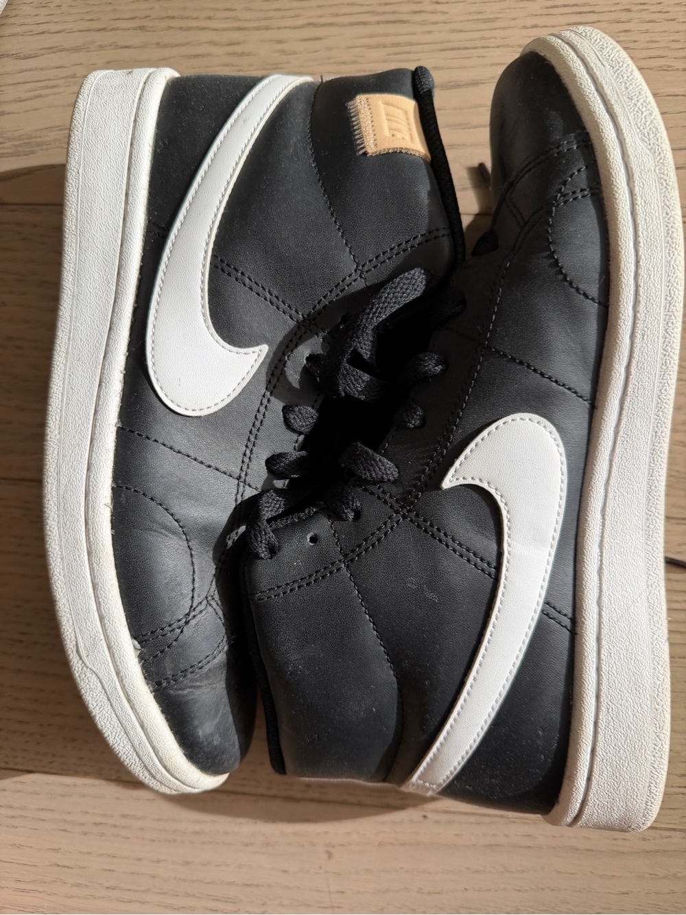 Nike Black High-Top Sneakers with White Swoosh
